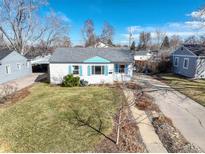 Charming single-story home with a well-maintained lawn and a long driveway at 3340 S Elm St, Denver, CO 80222