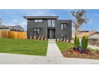 Modern two-story home with manicured lawn and contemporary design elements at 1459 W 42Nd Ave, Denver, CO 80211