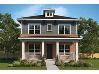 Charming two-story home with brick accents, a welcoming front porch, and professionally landscaped front yard at 21204 E 63Rd Dr, Aurora, CO 80019