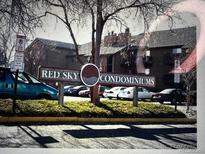 Exterior shot of the Red Sky Condominiums community signage and building at 14602 E 2Nd Ave # 108-C, Aurora, CO 80011