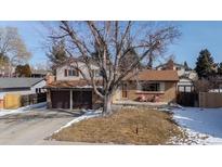 Charming two-story home with a mature tree, brick accents, two car garage, and a cozy front porch at 9430 Perry St, Westminster, CO 80031