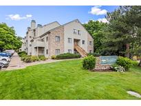 Well-maintained condo with a manicured lawn and inviting landscaping at 7369 S Gore Range Rd # 208, Littleton, CO 80127
