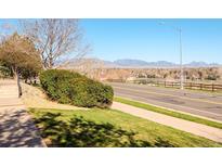 Scenic view from property overlooking neighborhood and mountains in the distance at 10149 W 55Th Dr # 3, Arvada, CO 80002