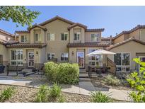 Attractive townhome with a tidy exterior and a cozy outdoor patio area at 4555 S Auckland Ct, Aurora, CO 80015