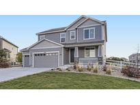 Charming two-story home with landscaped front yard and an attached two car garage at 5641 Echo Hollow St, Castle Rock, CO 80104