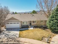 Charming single-story home with a two-car garage and well-maintained front yard, showcasing a welcoming curb appeal at 2517 S Eldridge Ct, Lakewood, CO 80228