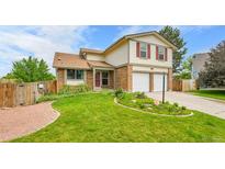 Charming two-story home featuring a well-manicured lawn and a two-car garage at 11149 Seton Pl, Westminster, CO 80031