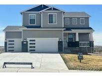 Charming two-story home with a three car garage and landscaped front yard at 42992 Colonial Trl, Elizabeth, CO 80107