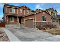 Two-story home with attached garage and landscaped front yard at 25829 E Calhoun Pl, Aurora, CO 80016
