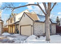 Two-story house with a brick facade and attached garage at 8962 Sunset Ridge Ct, Highlands Ranch, CO 80126