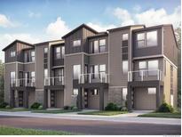 Modern townhome exteriors feature multi-toned siding, stone accents, balconies, and well-maintained landscaping at 2668 W 68Th Ave, Denver, CO 80221