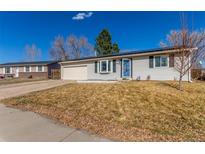 Classic single-Gathering home with solar panels, a garage, and a well-kept front yard in a sunny setting at 3541 E 118Th Ave, Thornton, CO 80233