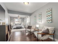 Inviting main bedroom featuring a plush bed, sitting area, and abundant natural light for a comfortable retreat at 3541 E 118Th Ave, Thornton, CO 80233