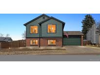 Charming home featuring a two-tone color scheme and an attached two-car garage at 1063 Lily Ct, Highlands Ranch, CO 80126