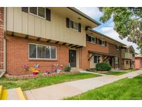 Brick townhouse with landscaping and walkway at 12644 W Virginia Ave, Lakewood, CO 80228