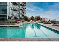 Stunning rooftop pool with comfortable lounge chairs and beautiful landscaping at 1700 Bassett St # 1119, Denver, CO 80202