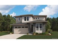 Beautiful two-story home featuring stone accents, neutral siding, large windows and an attached two-car garage at 498 S Rifle St, Aurora, CO 80017