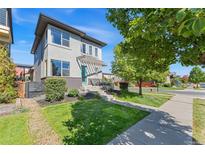 Beautiful two-story home with a modern design, a manicured lawn, and nice curb appeal at 1813 W 67Th Ave, Denver, CO 80221