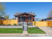 Charming home exterior boasts a landscaped front yard and inviting entrance at 15 Hazel Ct, Denver, CO 80219