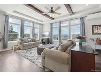 Spacious living room with mountain views and hardwood floors at 1729 Santa Fe Mountain Rd, Evergreen, CO 80439