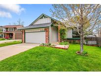 Charming single-Gathering home with well-maintained lawn and attached two-car garage at 4734 S Garland St, Littleton, CO 80123