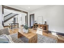 Bright living room with hardwood floors, and decorous furnishings that create a warm and inviting atmosphere at 1155 Garfield St, Denver, CO 80206