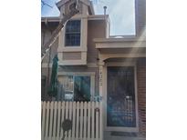 Charming two-story home with a welcoming entrance and manicured front yard at 14282 E Radcliff Cir, Aurora, CO 80015
