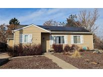 Charming single-story home featuring solar panels and a well-maintained front yard at 3493 S Eudora St, Denver, CO 80222