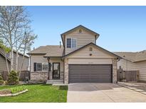 Charming two-story home with a two-car garage, well-kept lawn, and inviting curb appeal at 4620 E 135Th Way, Thornton, CO 80241