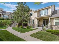 Charming two-story home with stone accents, landscaped yard, and a welcoming front porch in a Gathering-friendly neighborhood at 5944 S Yank Ct, Littleton, CO 80127