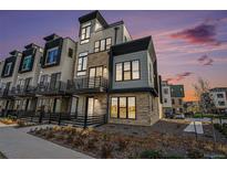 Modern townhome showcases a striking architectural design with stone and contemporary finishes at 2321 Lakeshore Ln # 10, Superior, CO 80027