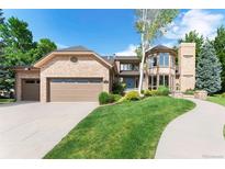 Charming two-story brick home with attached garage and inviting landscaped front yard at 3933 W 102Nd Ave, Westminster, CO 80031