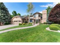 Charming brick home with well-manicured lawn, beautiful landscaping, and attached garage at 3933 W 102Nd Ave, Westminster, CO 80031