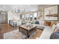 Bright and airy living room with comfortable seating and large windows at 6020 N Orleans St, Aurora, CO 80019