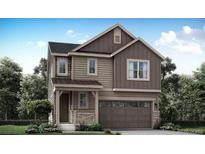 Charming two-story home with a welcoming front porch and attached garage at 14581 Hudson St, Thornton, CO 80602