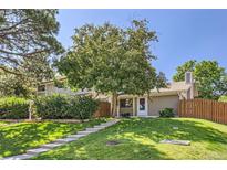 Charming home with a well-manicured lawn and mature tree providing ample shade at 2896 W 119Th Ave, Westminster, CO 80234