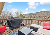 Outdoor deck with a grill, furniture, and a mountain view at 217 Ford St, Golden, CO 80403