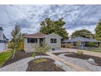 Charming ranch home with landscaped front yard and updated exterior at 4844 Vallejo St, Denver, CO 80221