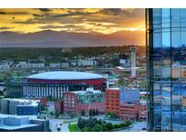 Breathtaking aerial view showcasing the city skyline, mountains, and a vibrant urban landscape at sunset at 1133 14Th St # 1820, Denver, CO 80202