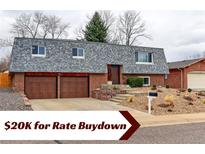 Charming two-story brick home with a two-car garage and a well-maintained front yard at 10679 Union Way, Broomfield, CO 80021