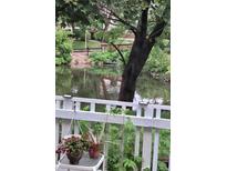 Relaxing view of the community pond, surrounded by lush landscaping and calming water features at 2840 S Kenton Ct, Aurora, CO 80014