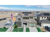 Two-story house with solar panels and landscaped yard, aerial view at 1781 Chestnut Ave, Erie, CO 80516