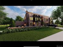Beautiful multi-level brick house with a well-manicured lawn and a cozy outdoor living space at 3330 E 4Th Ave, Denver, CO 80206