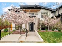 Beautiful home exterior featuring well-manicured landscaping and charming trees at 99 S Albion St, Denver, CO 80246