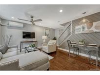 Inviting living room features hardwood floors, neutral tones, and stylish furnishings at 1355 Gaylord St # 6, Denver, CO 80206