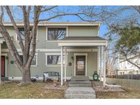 Charming townhome featuring a covered porch and a cozy bench, creating a welcoming entrance at 8348 W 90Th Ave, Broomfield, CO 80021