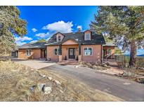 Beautiful ranch home with a welcoming front porch and stunning mountain views at 9128 Hillview Rd, Morrison, CO 80465