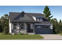 Charming craftsman style home with gray siding, and a two-car garage at 565 Twilight St, Erie, CO 80516