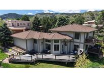 Beautiful home with a large deck, perfect for enjoying the serene outdoor view at 7084 Fox Paw Trl, Littleton, CO 80125