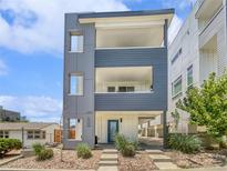 Modern three-story home with eye-catching architectural details and a welcoming entrance at 1245 Utica St # 104, Denver, CO 80204